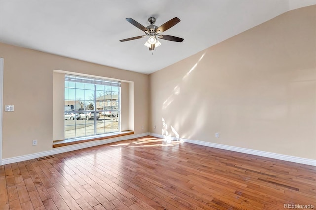 spare room featuring light hardwood / wood-style floors and ceiling fan