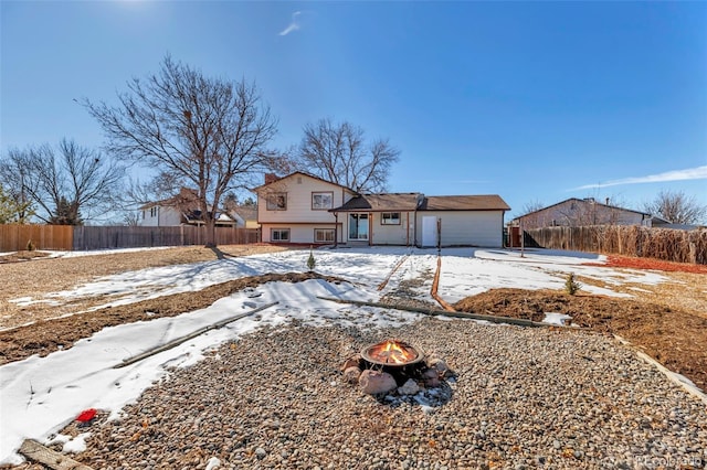 view of front of house with an outdoor fire pit