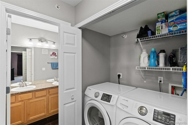 washroom featuring separate washer and dryer and sink