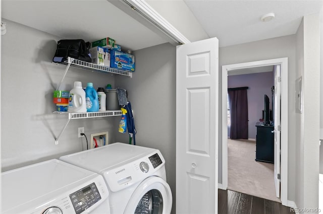 clothes washing area featuring dark hardwood / wood-style floors and independent washer and dryer