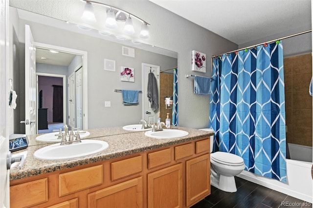 full bathroom with vanity, toilet, wood-type flooring, and shower / bath combo