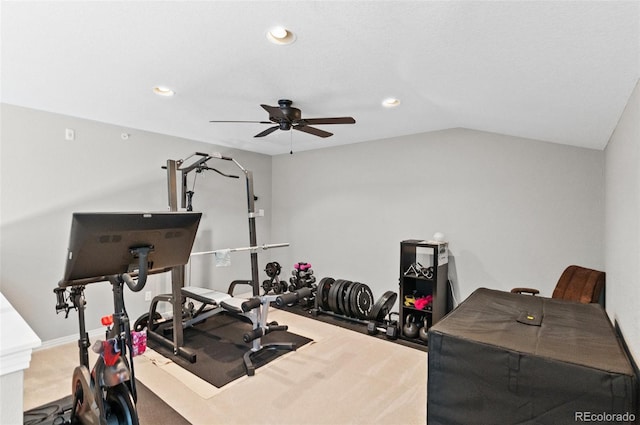 workout area featuring ceiling fan, carpet flooring, and vaulted ceiling