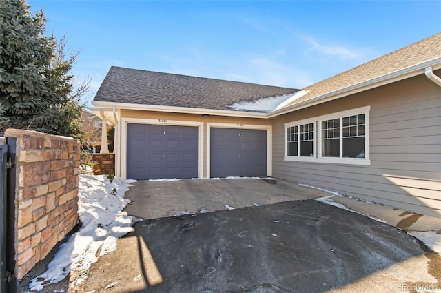 view of side of property with a garage