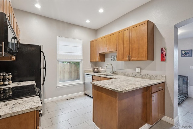 3429 N Adams St, Denver, CO 80205 - kitchen with electric stove, dishwasher, a peninsula, black microwave, and light tile patterned flooring