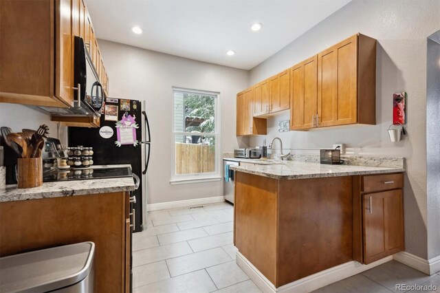 3429 N Adams St, Denver, CO 80205 - kitchen featuring light stone countertops, a peninsula, light tile patterned flooring, recessed lighting, and brown cabinetry