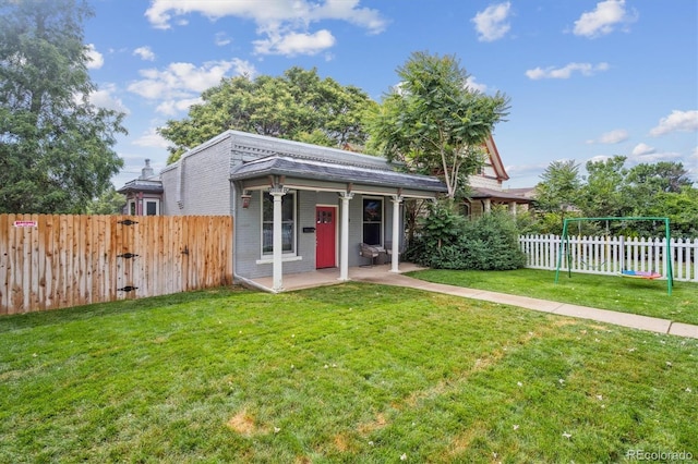 3429 N Adams St, Denver, CO 80205 - view of front of home featuring a fenced backyard and a playground