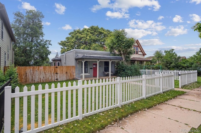 3429 N Adams St, Denver, CO 80205 - view of front of home with a fenced front yard and covered porch