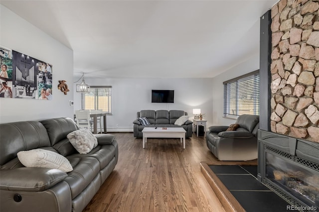 living room featuring a baseboard radiator and wood finished floors