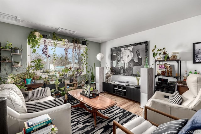 living area featuring visible vents and light wood-style flooring