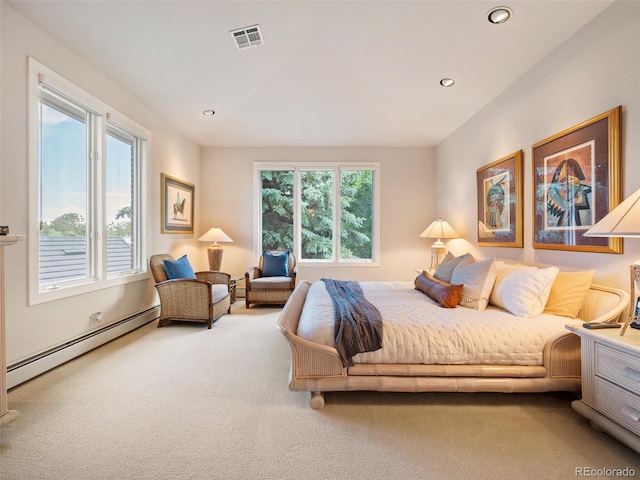 carpeted bedroom featuring a baseboard radiator