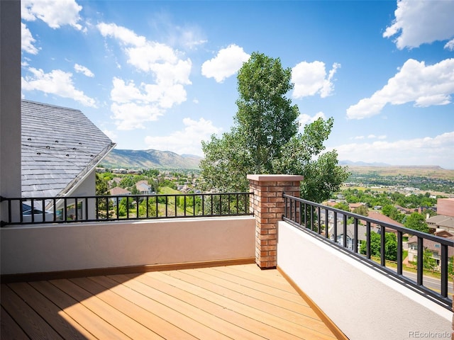 wooden deck featuring a mountain view