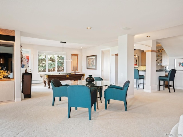 carpeted dining space with billiards and a baseboard heating unit