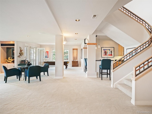 community lobby with visible vents and stairway