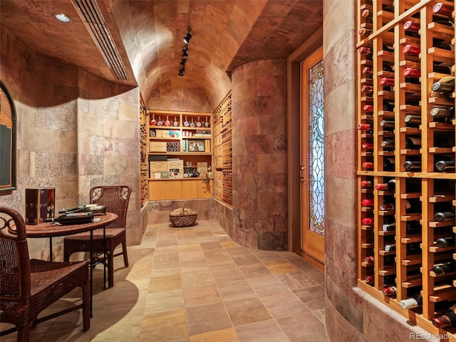 wine room featuring lofted ceiling