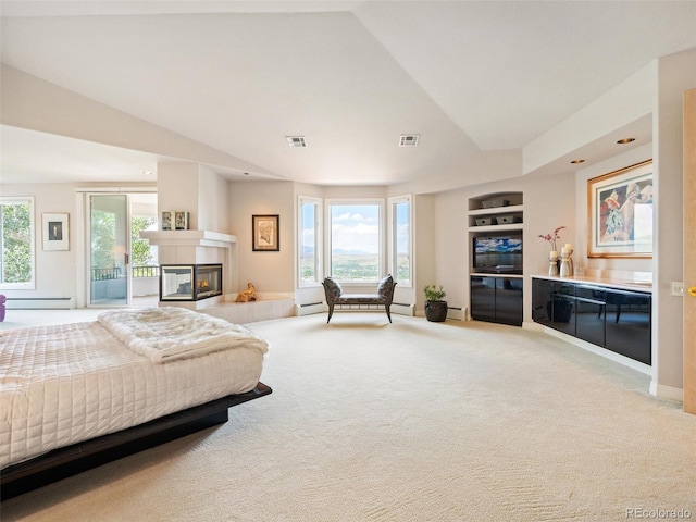 bedroom with a baseboard heating unit, a multi sided fireplace, visible vents, vaulted ceiling, and carpet