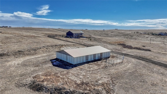 birds eye view of property featuring a rural view