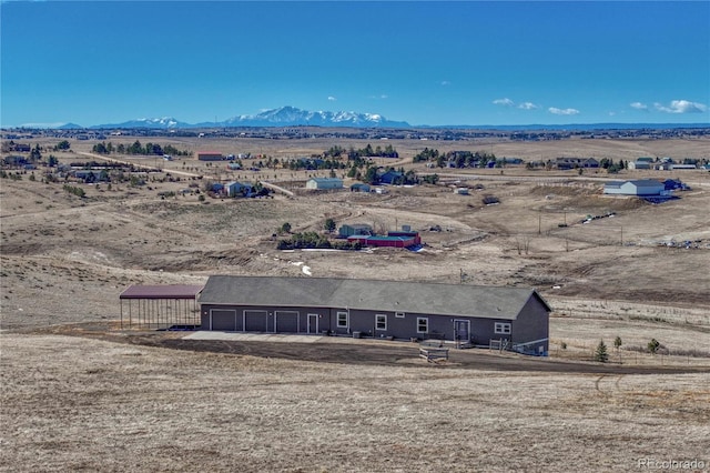 aerial view featuring a rural view and a mountain view