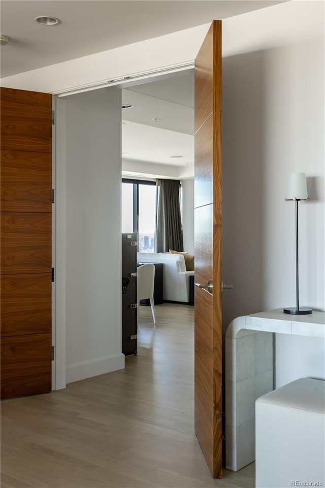 hallway with light wood-type flooring