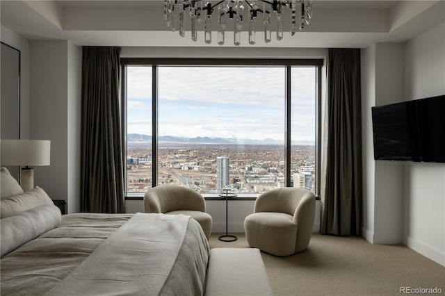 bedroom with carpet floors and a notable chandelier