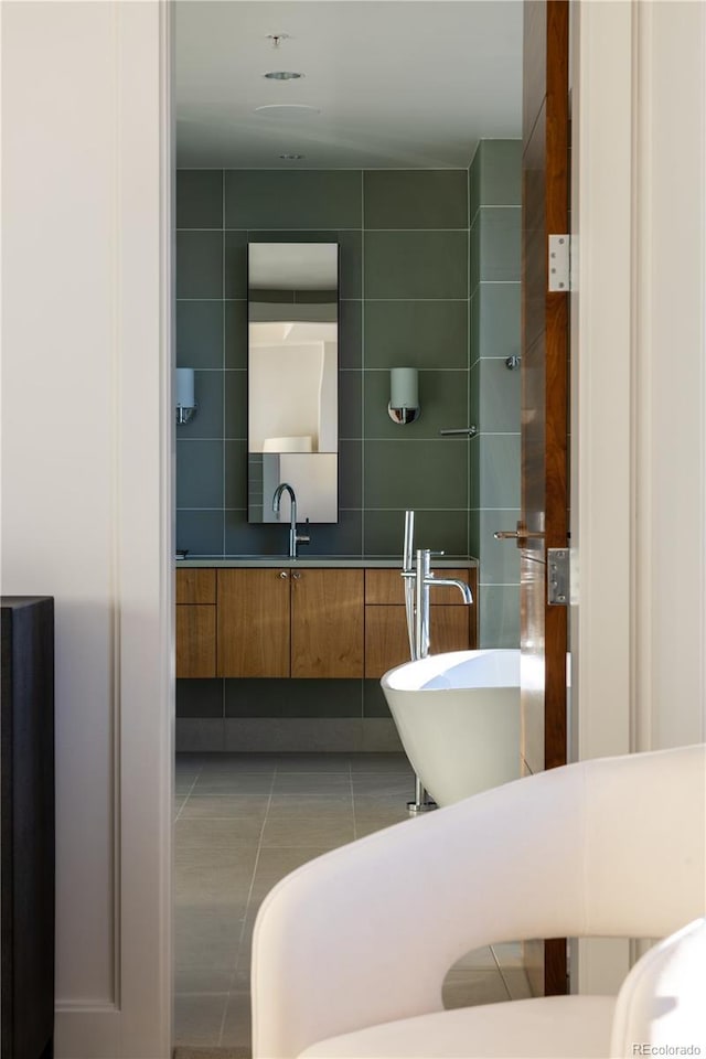 bathroom featuring vanity, tile walls, and tile patterned floors