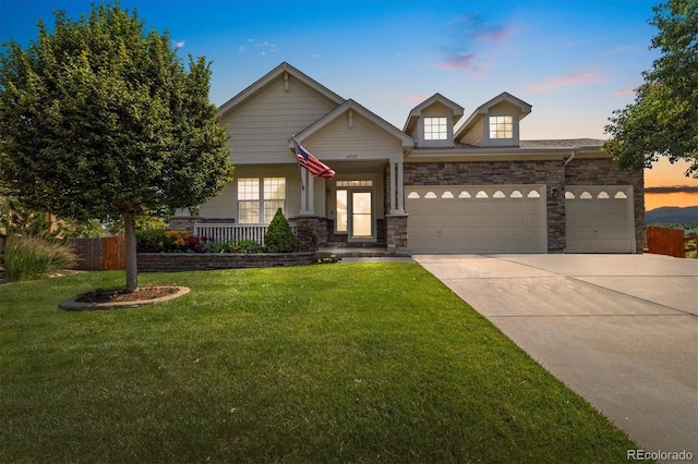12522 Locust Way, Thornton, CO 80602 - craftsman-style house featuring an attached garage, stone siding, concrete driveway, and a porch
