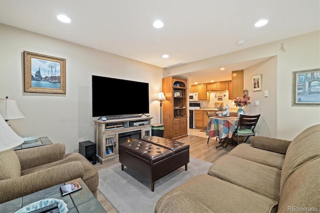 12522 Locust Way, Thornton, CO 80602 - living room with light wood-style flooring and recessed lighting