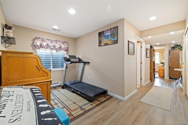 12522 Locust Way, Thornton, CO 80602 - exercise room featuring a baseboard heating unit, light wood-type flooring, and recessed lighting