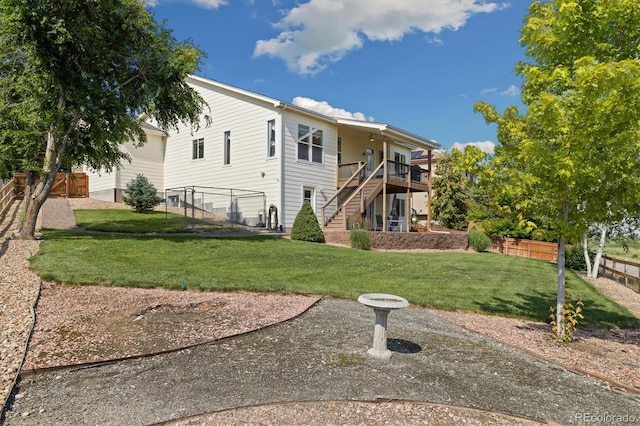 12522 Locust Way, Thornton, CO 80602 - rear view of property featuring stairway and a wooden deck