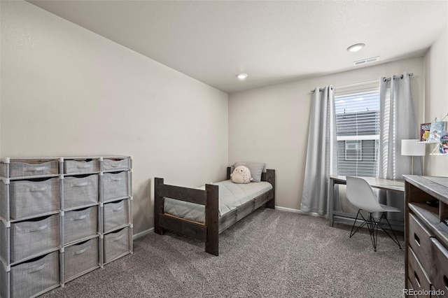 bedroom with visible vents, carpet flooring, and baseboards