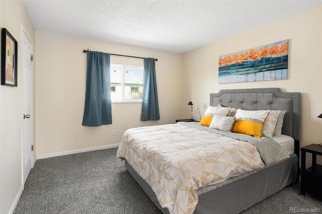 carpeted bedroom with a textured ceiling and baseboards