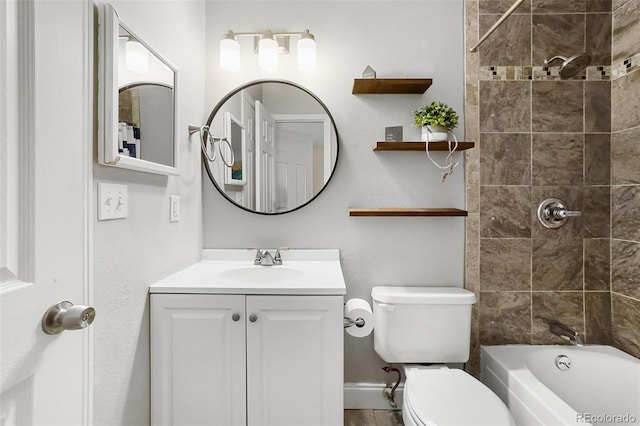 full bath featuring toilet, vanity, baseboards, and washtub / shower combination