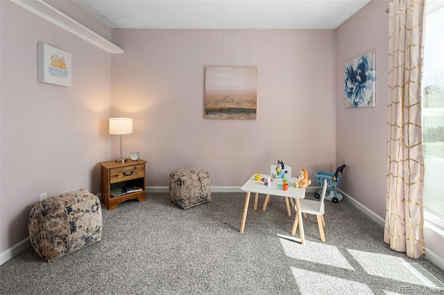 playroom featuring baseboards and carpet