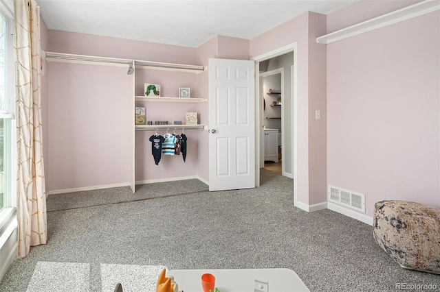 bedroom with visible vents, baseboards, and carpet flooring