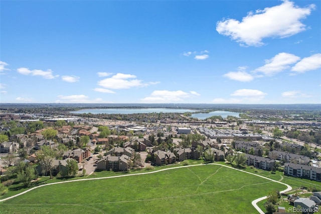 aerial view of residential area with a nearby body of water and property parcel outlined