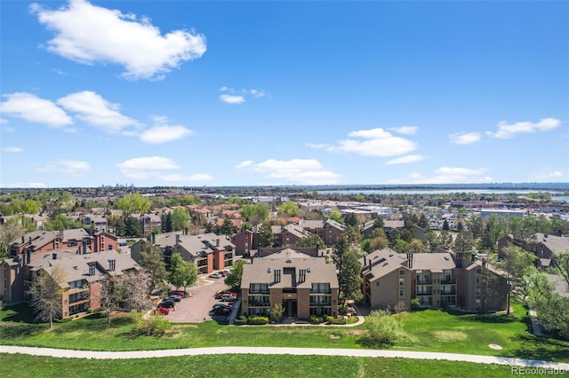 aerial perspective of suburban area with a large body of water