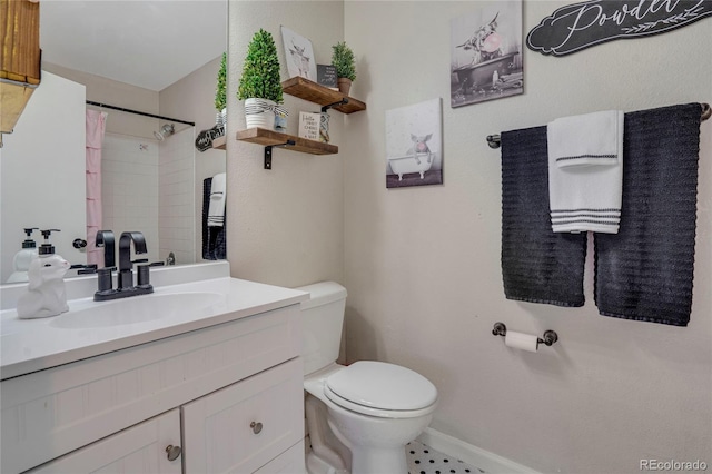 bathroom featuring baseboards, toilet, vanity, and a shower with curtain