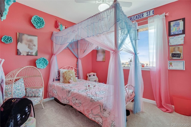 carpeted bedroom with baseboards and ceiling fan
