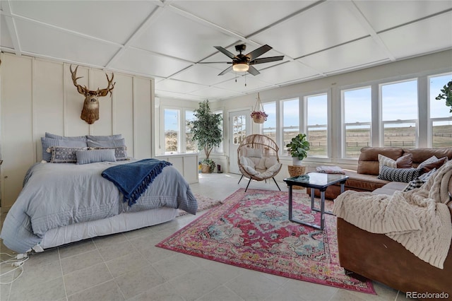 tiled bedroom featuring coffered ceiling