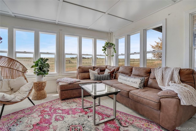 sunroom / solarium with plenty of natural light and tile patterned floors