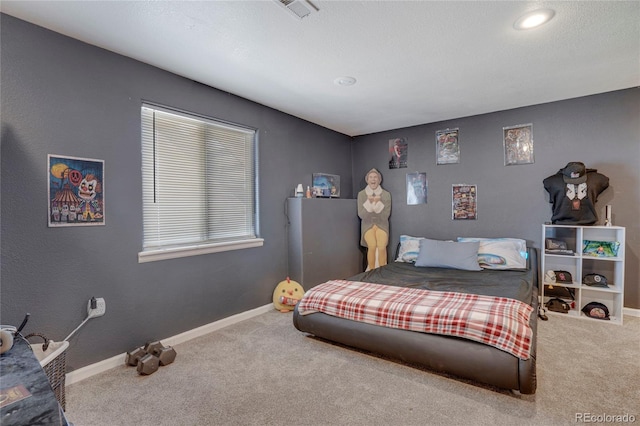 carpeted bedroom featuring baseboards, visible vents, and recessed lighting