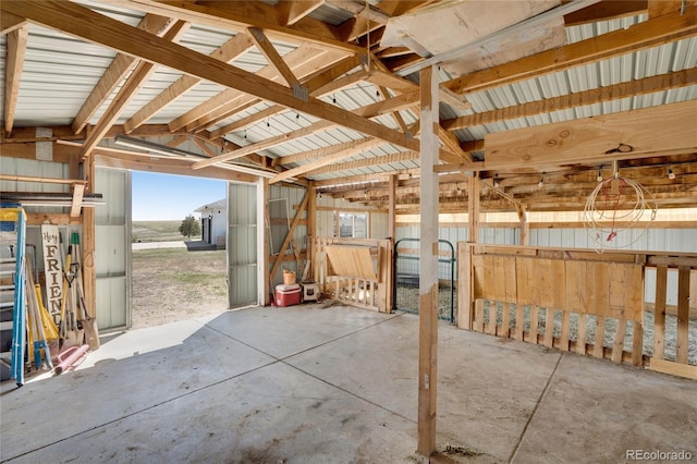 interior space featuring unfinished concrete flooring