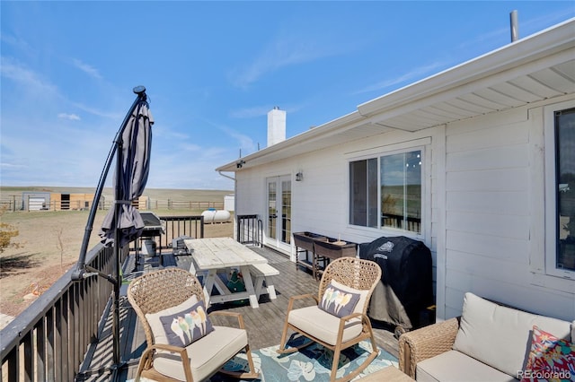wooden deck with grilling area and french doors