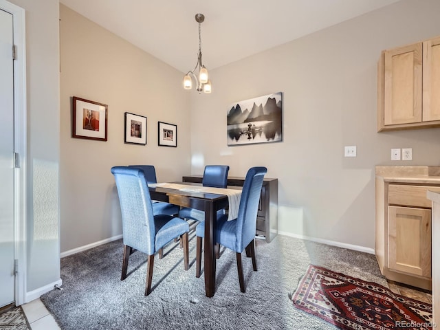 dining area featuring an inviting chandelier, carpet flooring, and baseboards