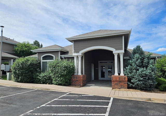 view of property featuring uncovered parking