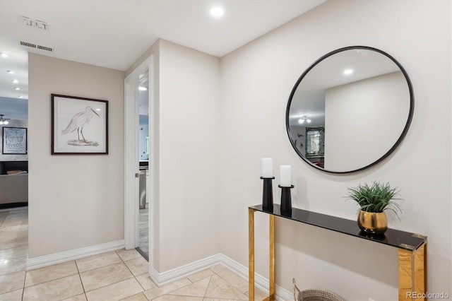 hall featuring light tile patterned floors