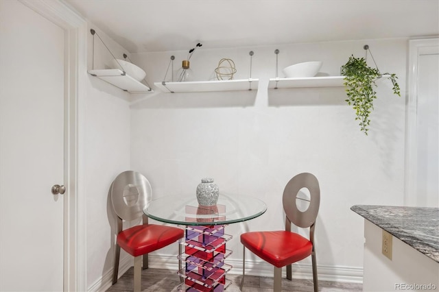 dining area with wood-type flooring