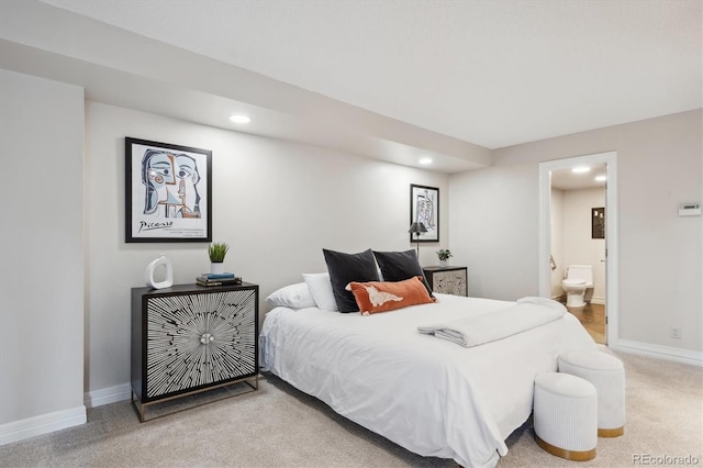 bedroom with carpet and connected bathroom