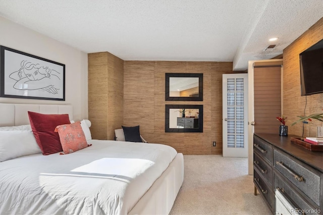 carpeted bedroom featuring a textured ceiling