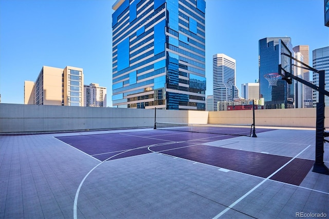 view of basketball court featuring tennis court