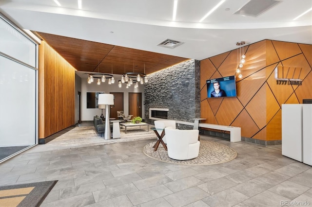 reception area featuring a stone fireplace